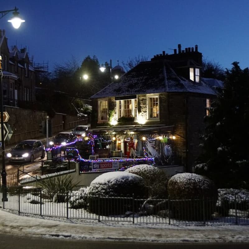 The Castle Tavern lit up at dusk, Inverness